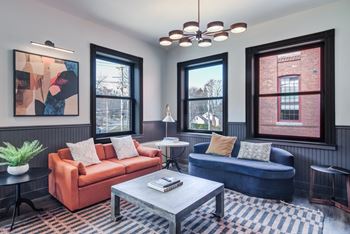 Clubroom with lounge seating & restored fireplaces
